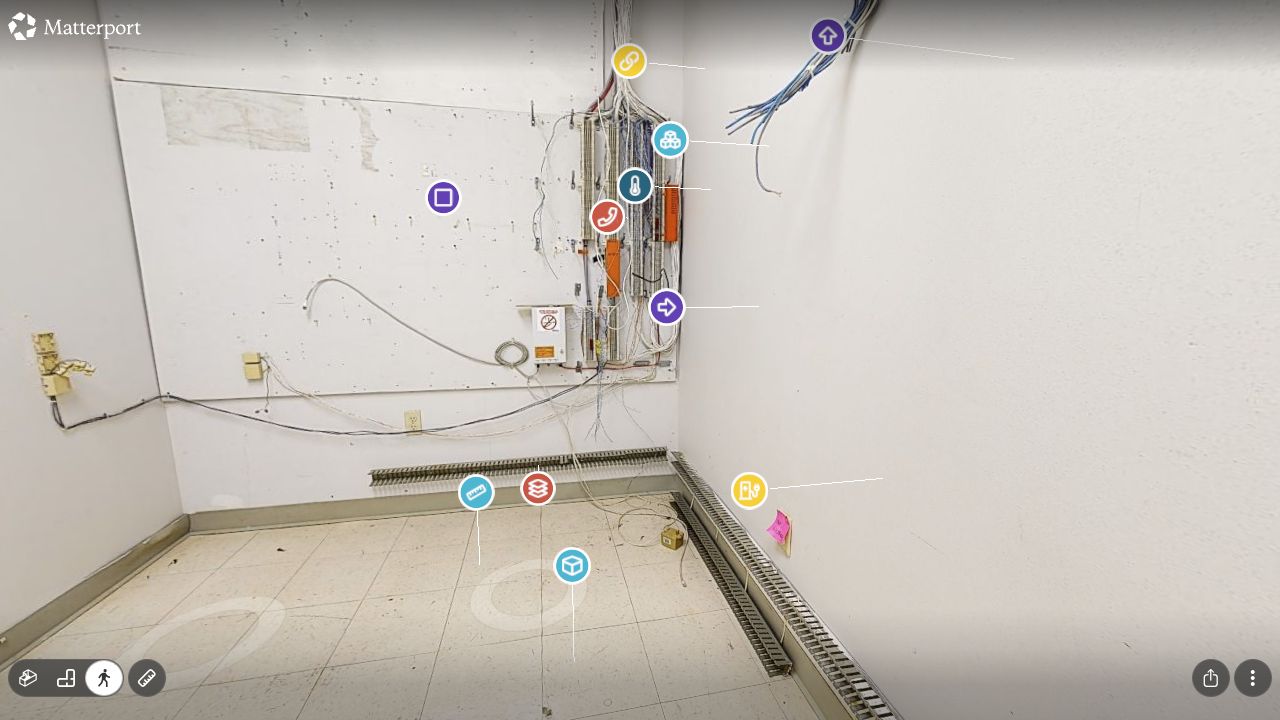 Communication room with refreshed color-coded icons marking cabling, equipment, backboard, and floor-area notes